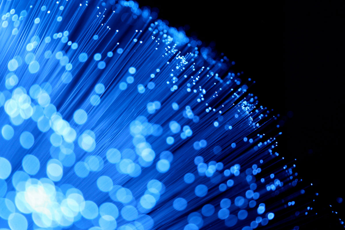 A close up of some blue wires on a black background